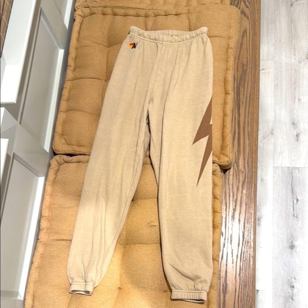 Aviator Nation Tan Track Pants with Brown Lightning Bolt